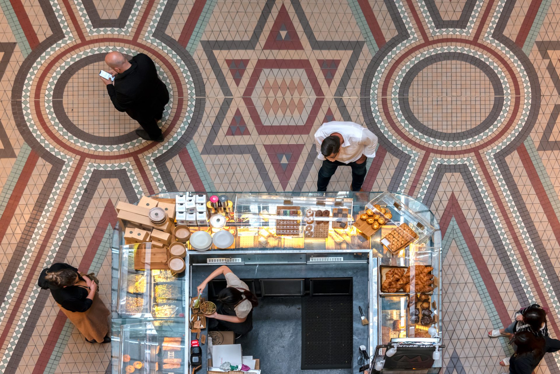 Customers selecting food at a cafe in in the Queen Victoria Building, Sydney, Australia