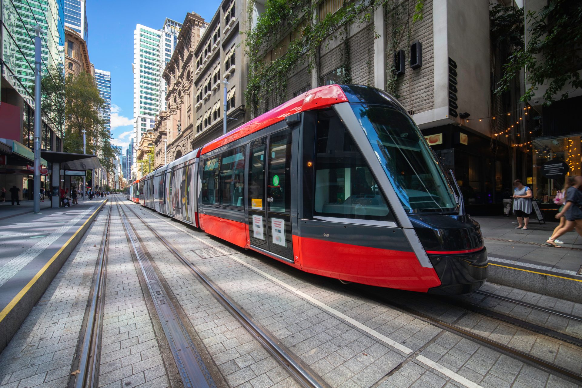 Tram moving through George St in Sydney NSW Australia